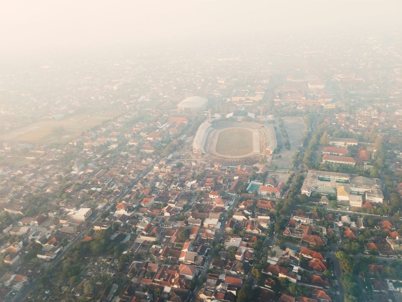 building exterior, architecture, cityscape, built structure, city, aerial view, crowded, high angle view, residential district, residential building, residential structure, community, landscape, human settlement, city life, clear sky, sky, outdoors, house, no people