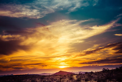 Scenic view of dramatic sky during sunset