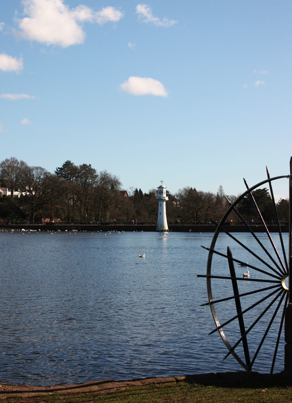 VIEW OF LIGHTHOUSE BY LAKE