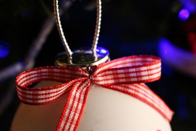 Close up of bauble hanging on christmas tree