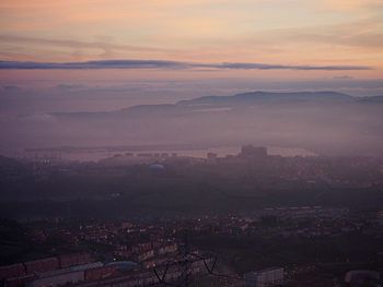 High angle view of townscape against sky at sunset