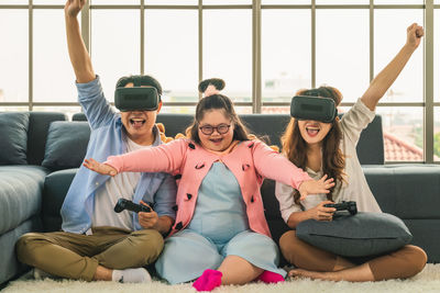 Group of people sitting on sofa