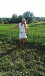 Full length of girl standing on field