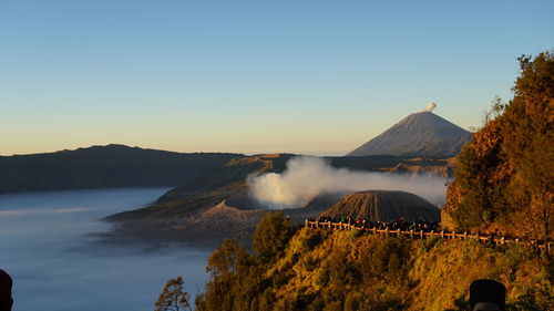 Scenic view of mountains against clear sky during sunset