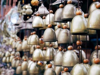 Close-up of wind chimes hanging for sale in market