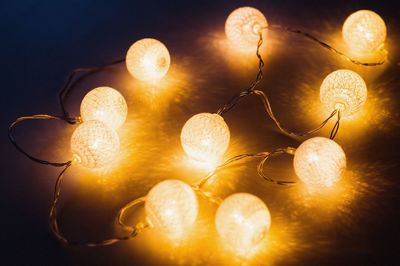 Close-up of illuminated lighting equipment