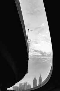 Low angle view of silhouette buildings against sky