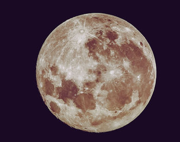 Low angle view of moon against sky at night