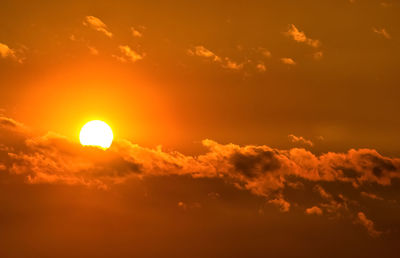 Low angle view of cloudy sky at sunset