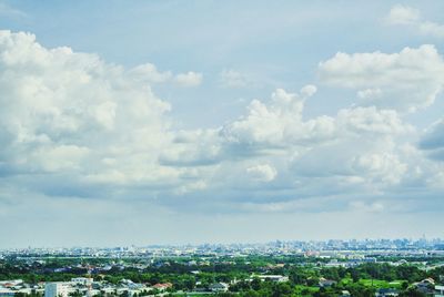 Aerial view of cityscape against sky