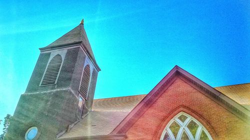 Low angle view of building against blue sky