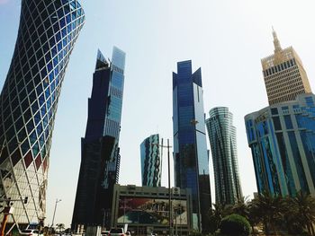 Low angle view of buildings in city against clear sky