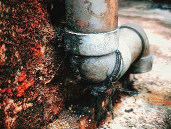 Close-up of rusty metal against wall