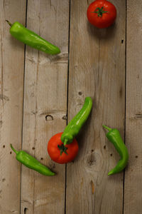 High angle view of green chili peppers on table