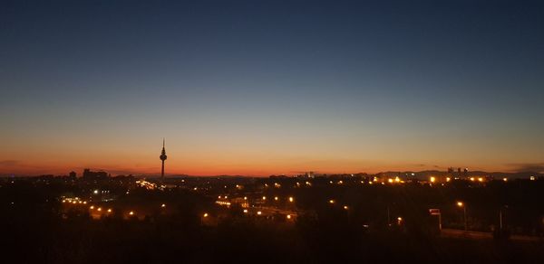 High angle view of illuminated buildings against sky during sunset