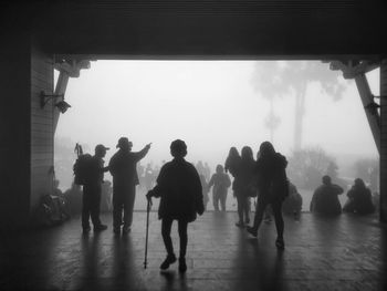 Group of people walking in corridor of building