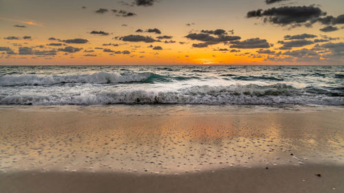 Scenic view of sea against sky during sunset