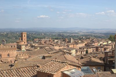 High angle view of townscape against cloudy sky