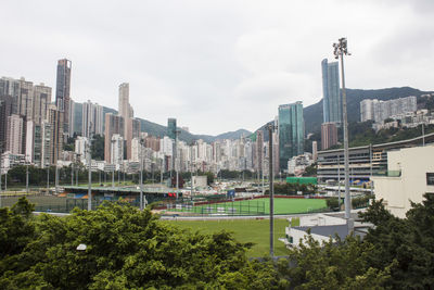 High angle view of buildings in city against sky