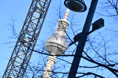 Low angle view of electricity pylon against sky