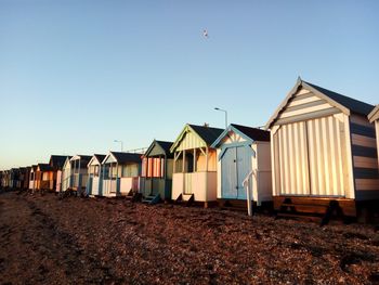 Built structure on beach against clear sky