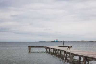 Pier over sea against sky