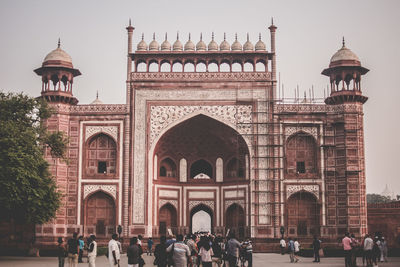 Group of people in front of historical building