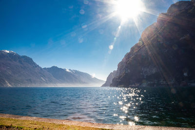 Scenic view of sea against sky on sunny day