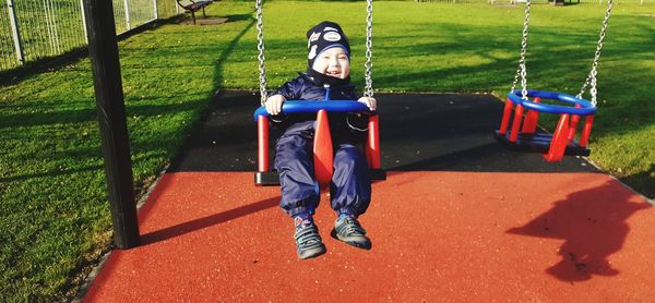 Full length of man on slide at playground
