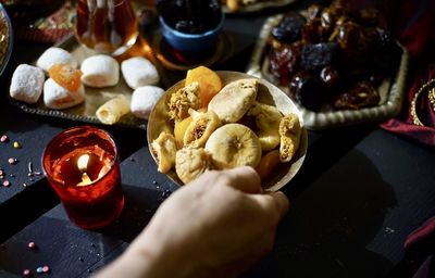 Cropped hand of person holding food