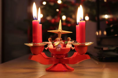 Close-up of tea light candles on table