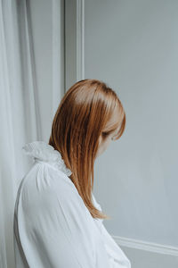 Side view of young woman looking away