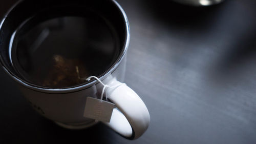 High angle view of coffee cup on table