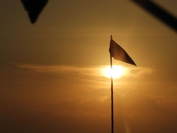 Low angle view of silhouette street light against sky during sunset