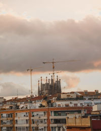 Low angle view of buildings against sky during sunset