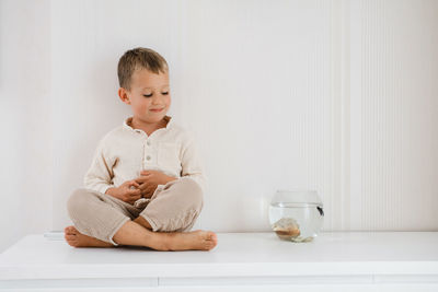 Child near aquarium at home