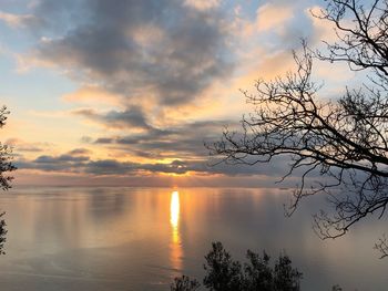 Scenic view of lake against orange sky