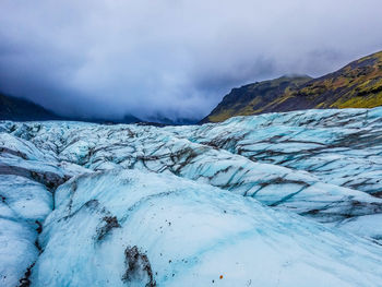 Scenic view of landscape against sky during winter