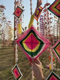 Low angle view of decoration hanging outside building