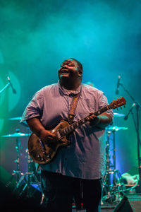 Full length of a person playing guitar