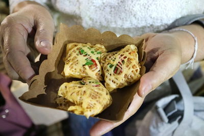 Fried prawns and nut wrapped in an egg net, latieng. thai dessert concept.