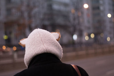 Rear view of person wearing knit hat during winter