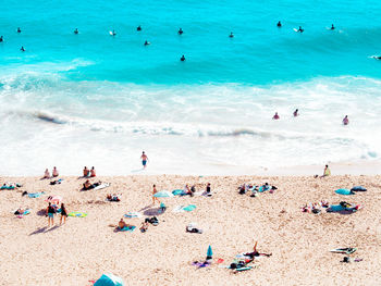 High angle view of people enjoying at beach