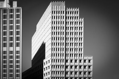 Low angle view of modern buildings in city against sky