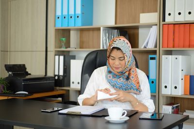 Woman sitting at home