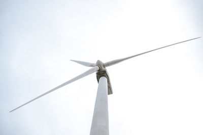 Low angle view of wind turbine against sky