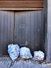 Garbage against doors of building