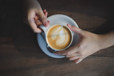 High angle view of coffee cup on table