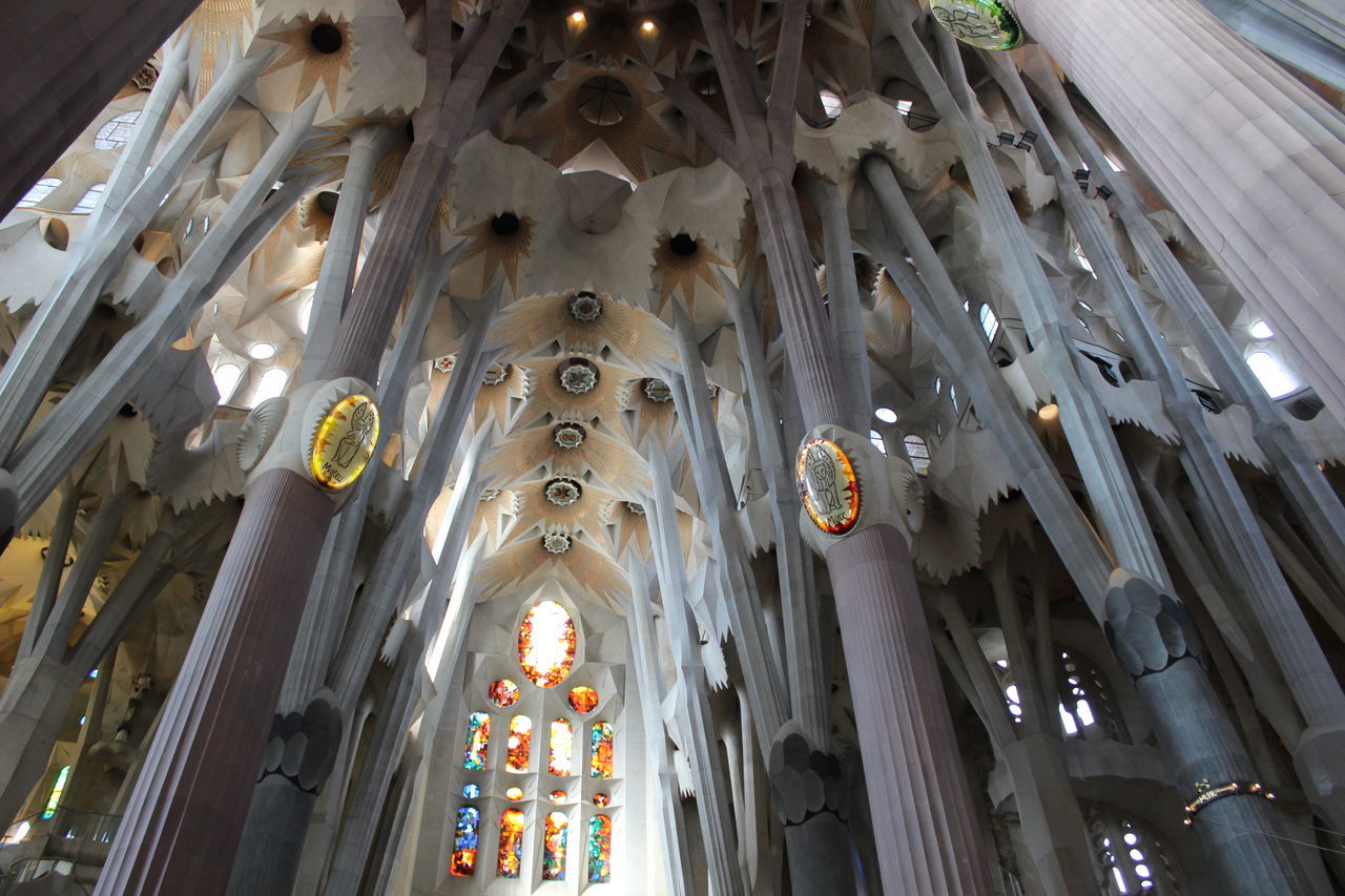 low angle view, ceiling, arch, illuminated, architecture, built structure, religion, indoors, modern, church, place of worship, architectural feature, arcade, architectural column, famous place