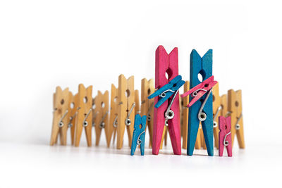 Close-up of clothespins against white background